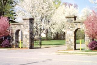 Stone archways with flowering trees