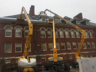 three cranes assist with roofing project