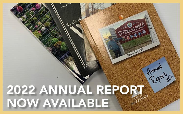 An array of Annual reports with 2022 on the top. Lois Benjamin is on the cover pointing to the new sign at Veterans Field